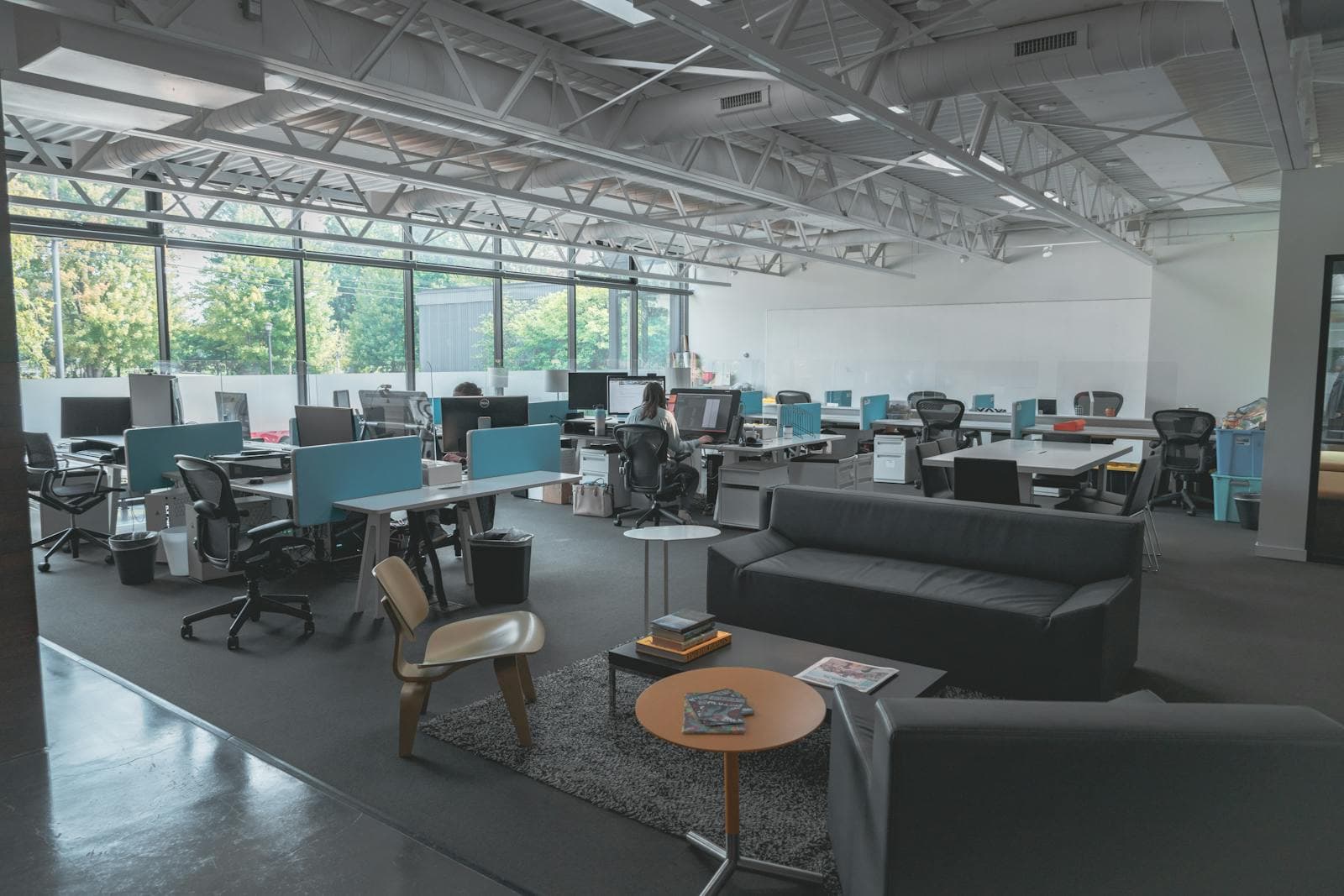 Modern open-plan back-office workspace, representing the cross-industry operations Nascaps runs