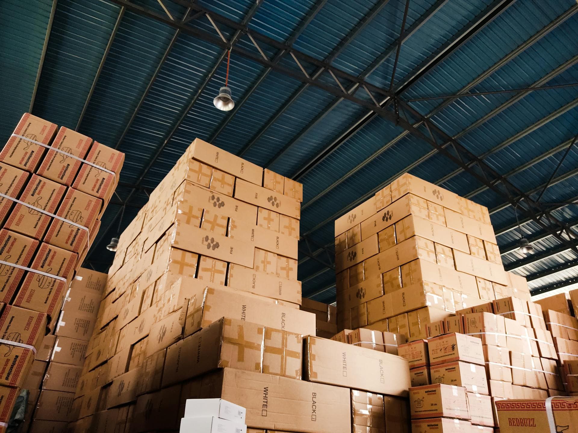 Stacked goods in a warehouse, representing the operational scope Nascaps's services cover
